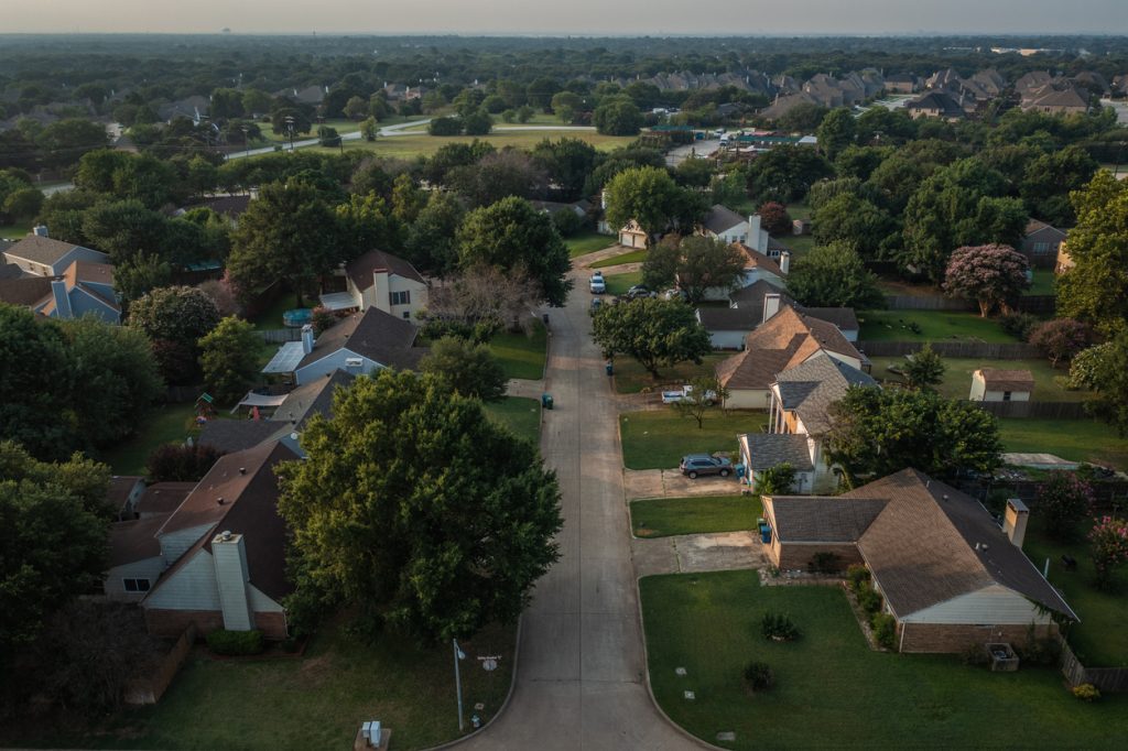 Houses Along Street in Neighborhood Surrounded by Trees in Southlake, Texas